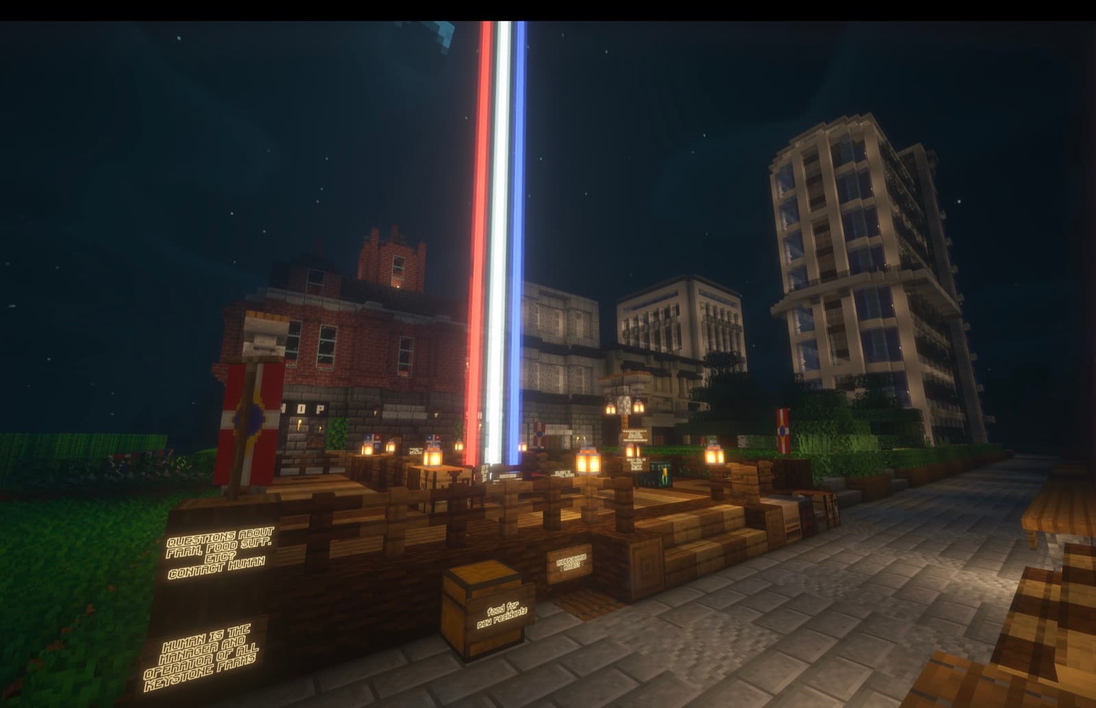 Cadeau — the flag row, and the tricolour beacon over the square.